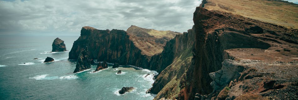 Stunning cliffs at Madeira, Portugal with Atlantic Ocean view, perfect for nature and travel enthusiasts.